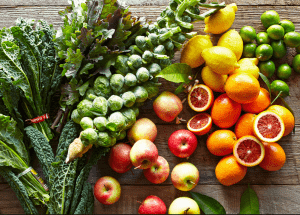 a group of fruits and vegetables on a wood surface Healthy Weight Loss Diets Byfleet