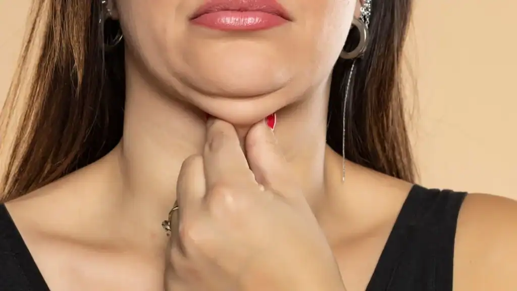 An image of a woman with double chin, sad, worried : Non Surgical Double Chin Removal Treatment in Byfleet, UK